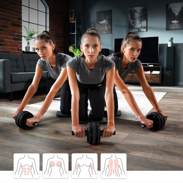 donna che si allena con una ruota nera del marchio Hop-Sport