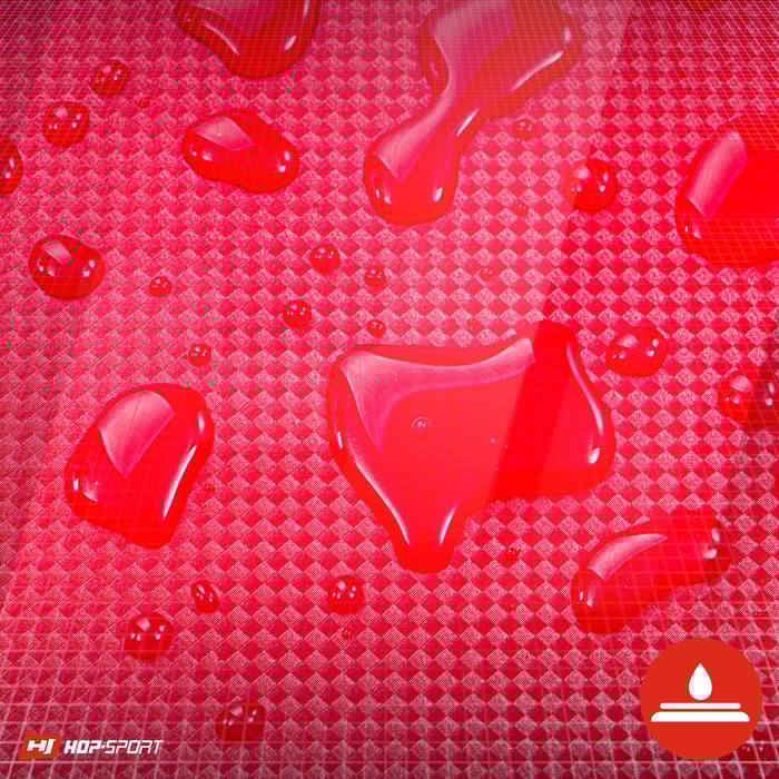 Primo piano del rivestimento impermeabile del materasso ginnico Hop-Sport di colore rosso