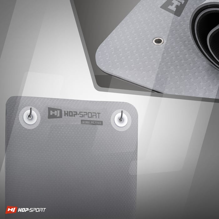 Fori pratici che permettono di appendere il tappetino TPE di colore grigio del marchio Hop-sport